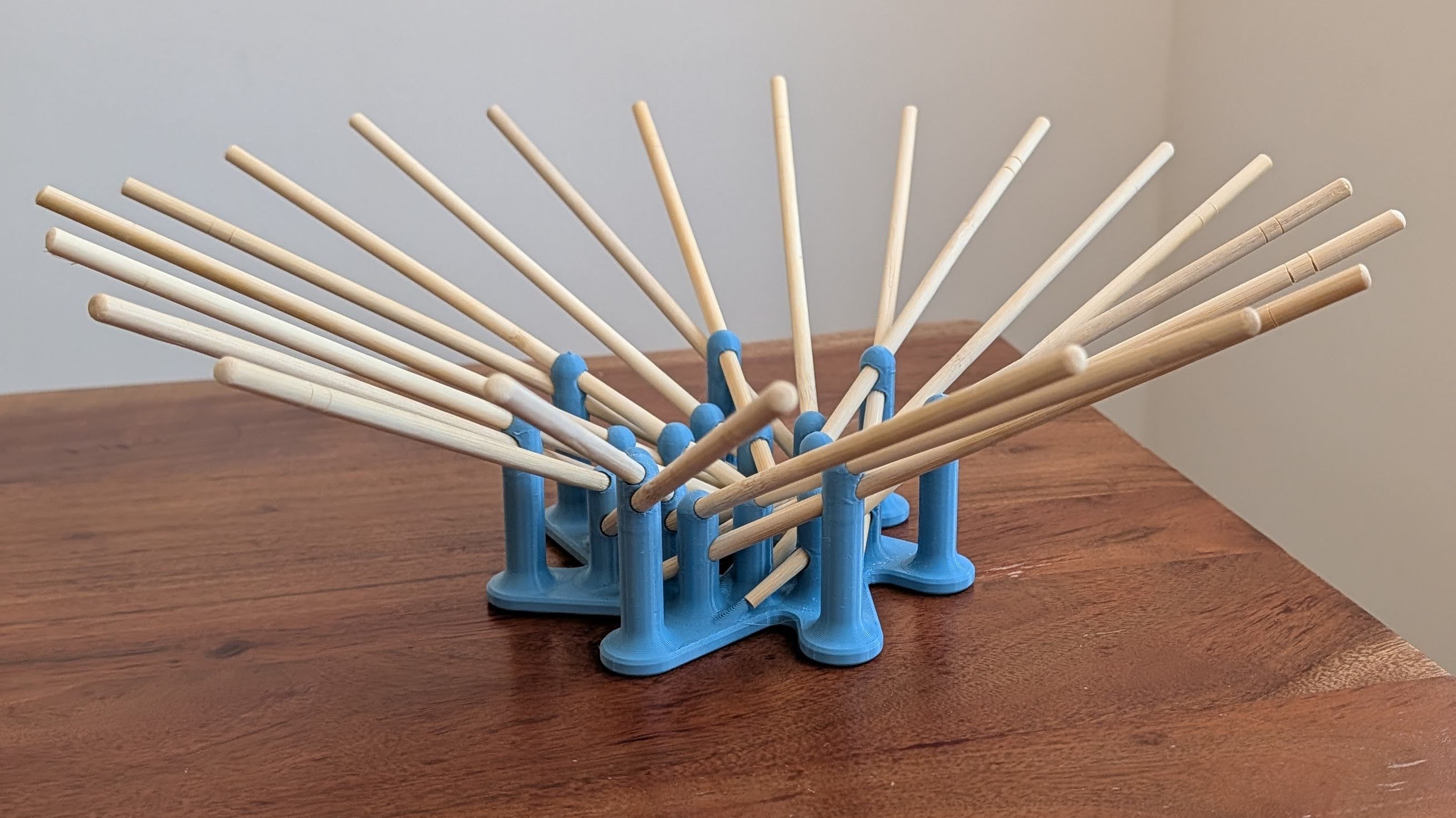 Angled view of the printed connector and chopsticks forming the bowl shape